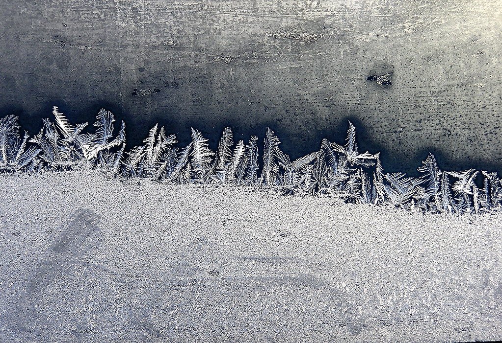 Frosty window on a cold winter day