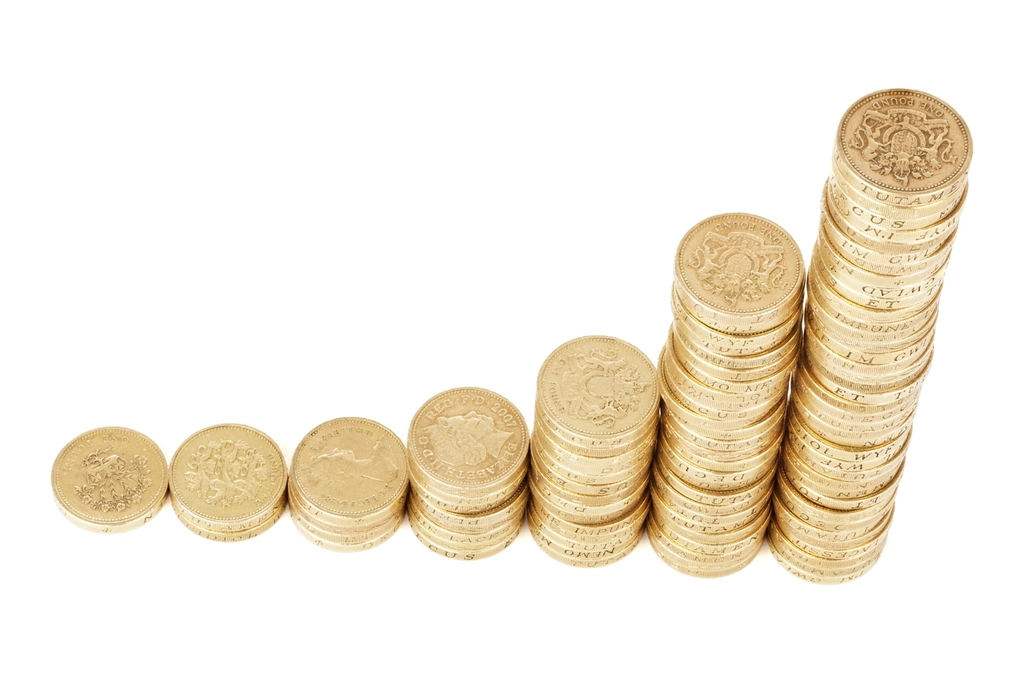 Coins stacked in ascending order symbolizing investing