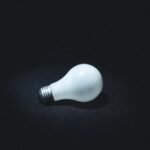 Lit light bulb symbolizing an invention