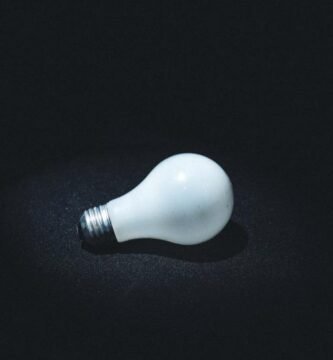 Lit light bulb symbolizing an invention