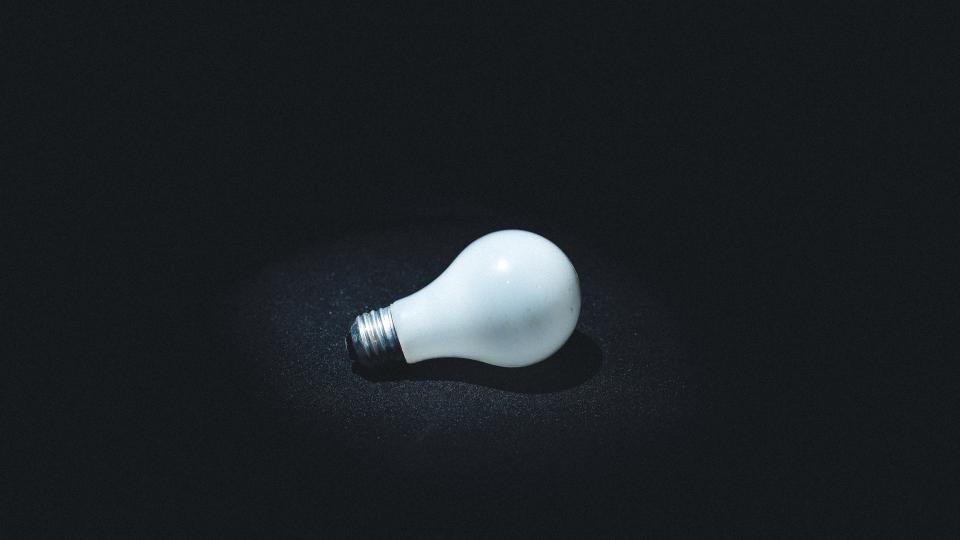 Lit light bulb symbolizing an invention