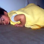Person sleeping in bed