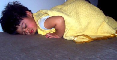 Person sleeping in bed