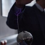 Spark of static electricity jumping between a finger and a metal doorknob