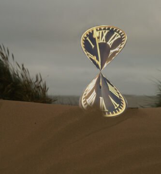 Hourglass on a desk representing time passing