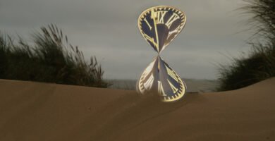 Hourglass on a desk representing time passing