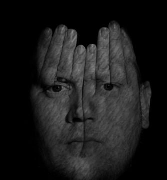 Person with insomnia checking the clock at night