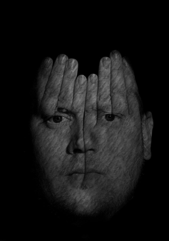Person with insomnia checking the clock at night
