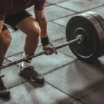 Man lifting weights at the gym