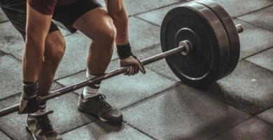 Man lifting weights at the gym