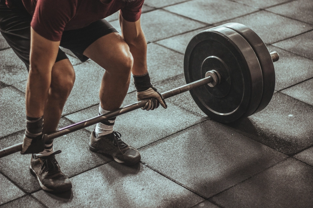 Man lifting weights at the gym
