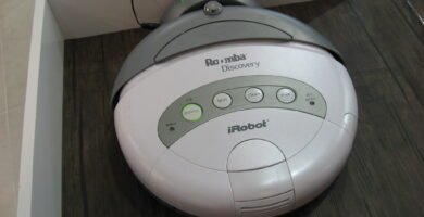 Robot vacuum cleaning a living room floor