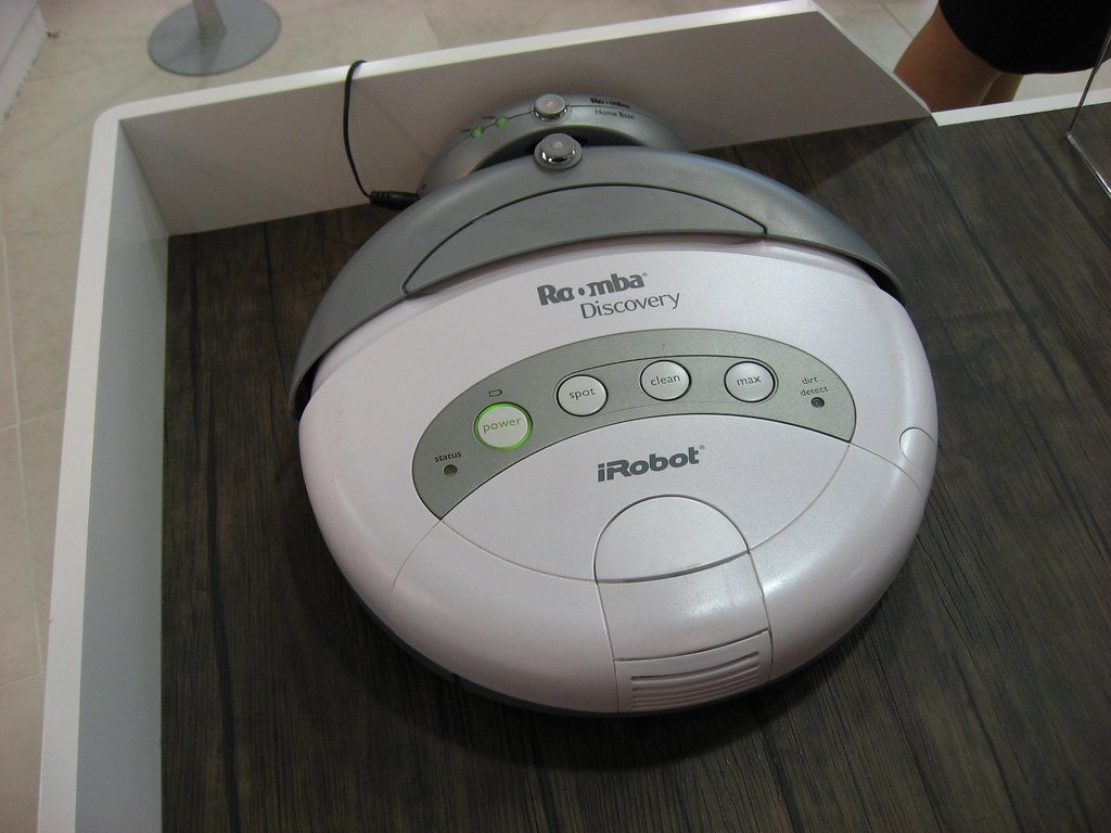 Robot vacuum cleaning a living room floor