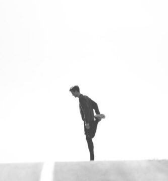 Runner stretching their leg