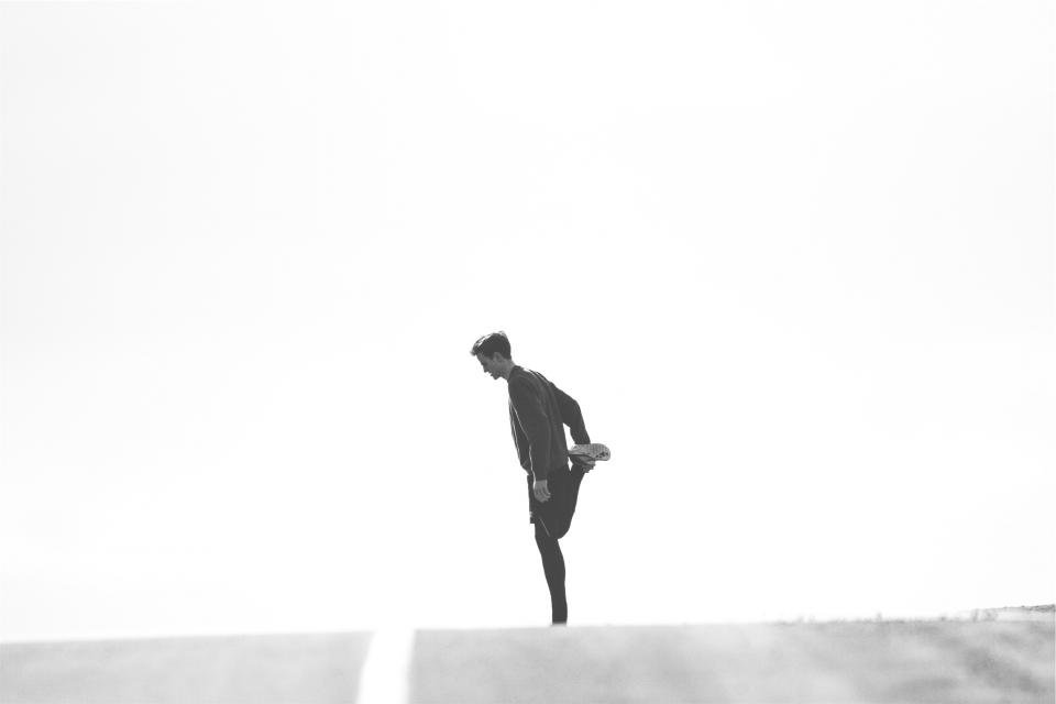 Runner stretching their leg