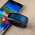 Smartwatch on a wrist showing a health and fitness data screen