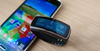 Smartwatch on a wrist showing a health and fitness data screen