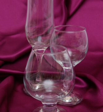 Glass of red wine on a wooden table