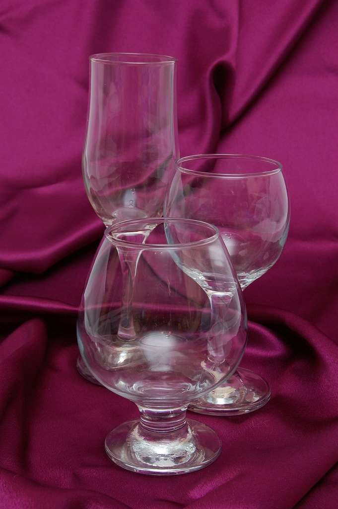 Glass of red wine on a wooden table